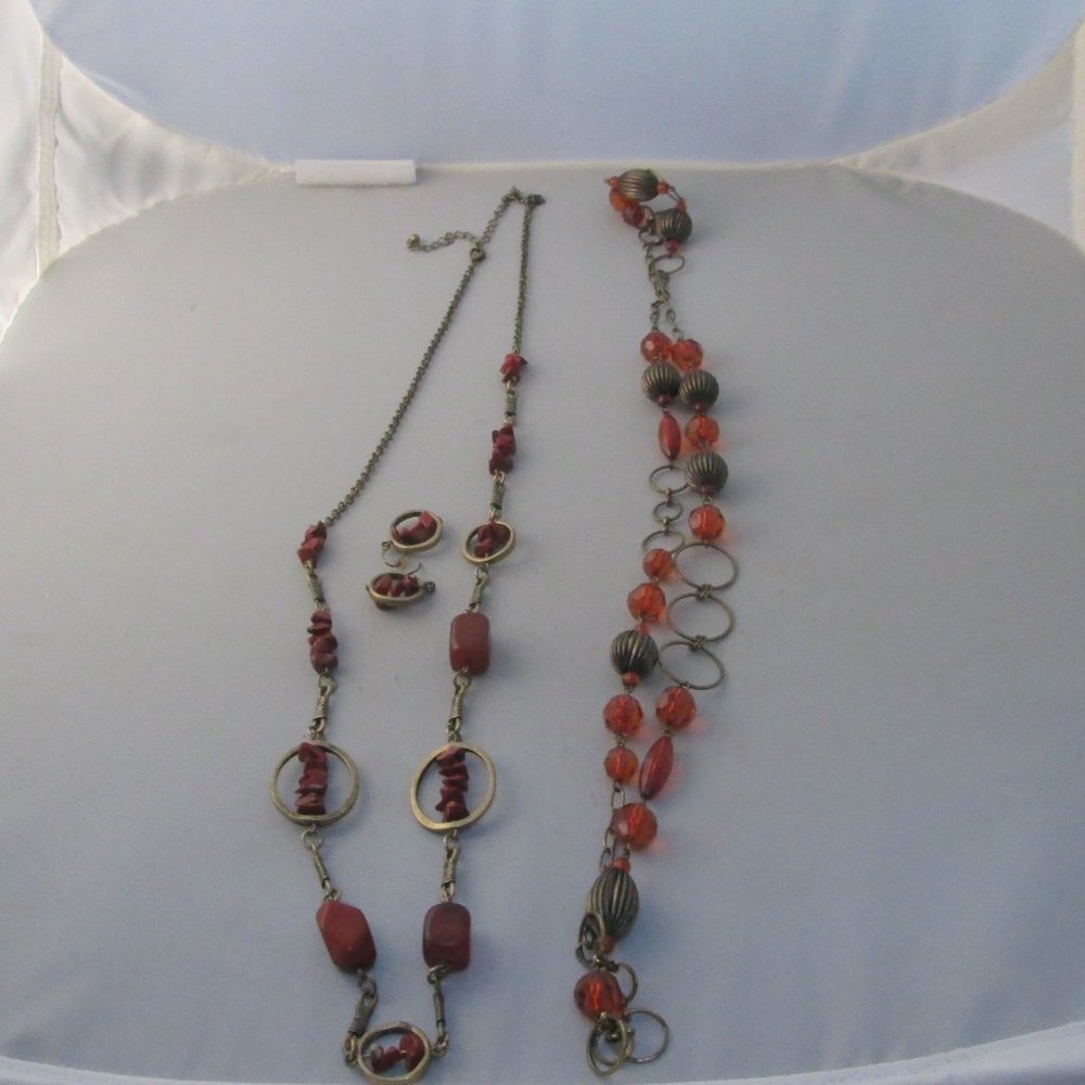 Necklaces and earrings left one is rust w/matching earrings
